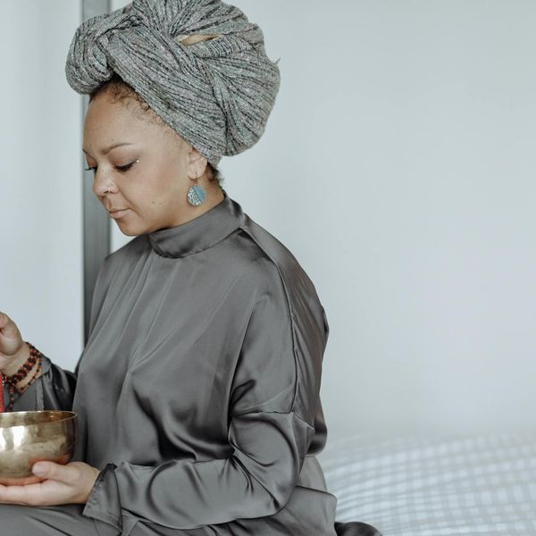 Person meditating peacefully, representing mental clarity and overall well-being.